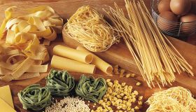 High angle view of assorted pasta and ingredients