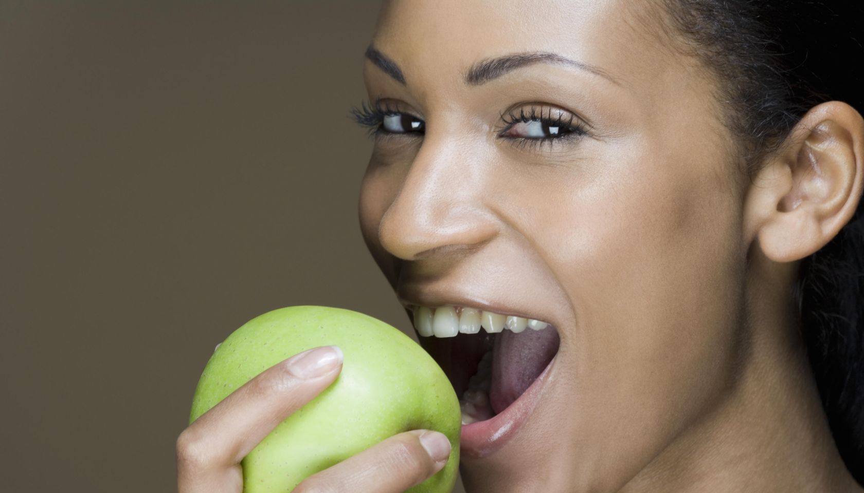 A woman eating an apple