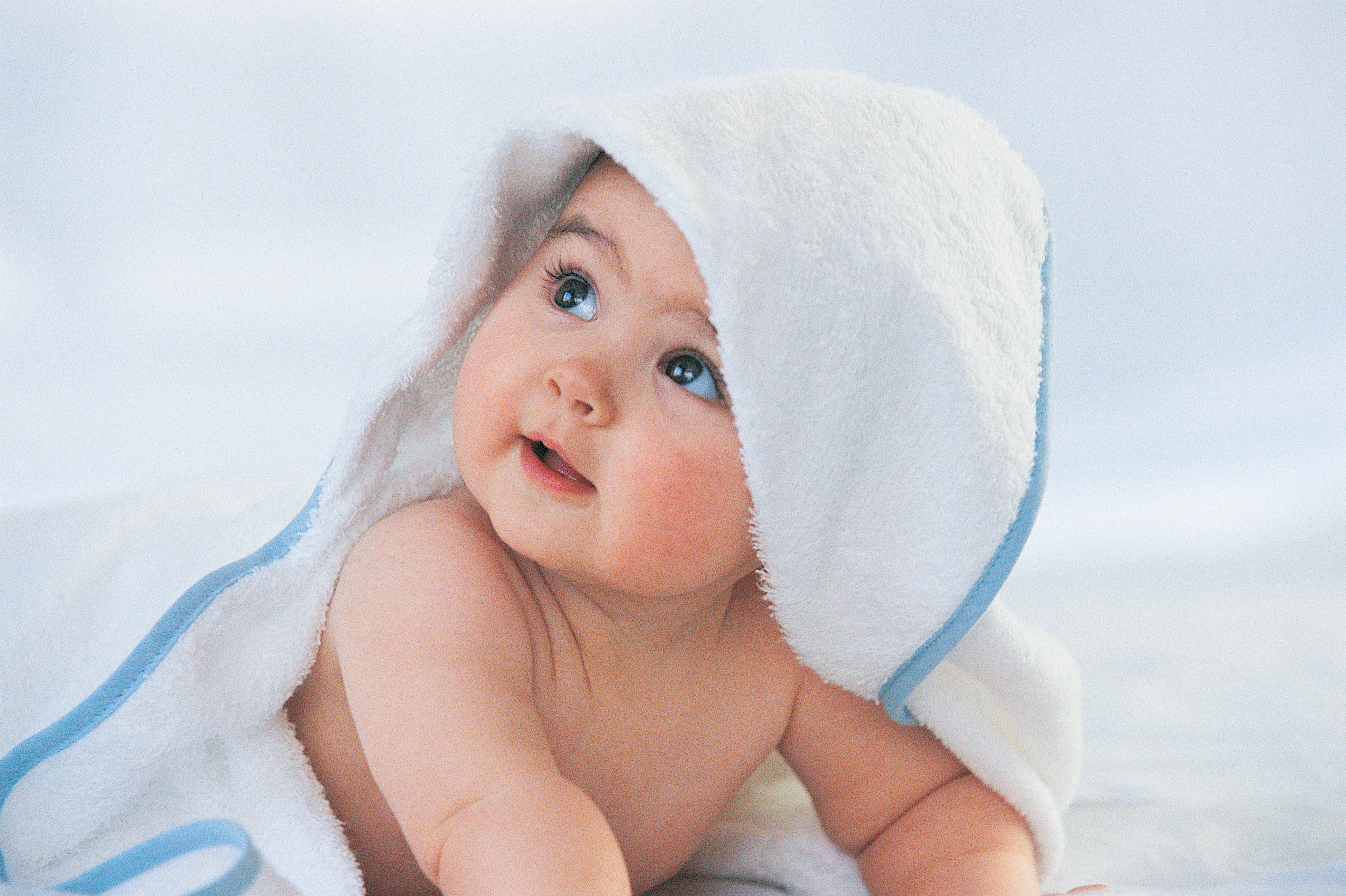 Baby Looking Up With a Towel Covering its Head