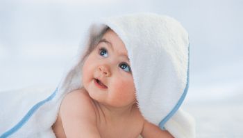 Baby Looking Up With a Towel Covering its Head