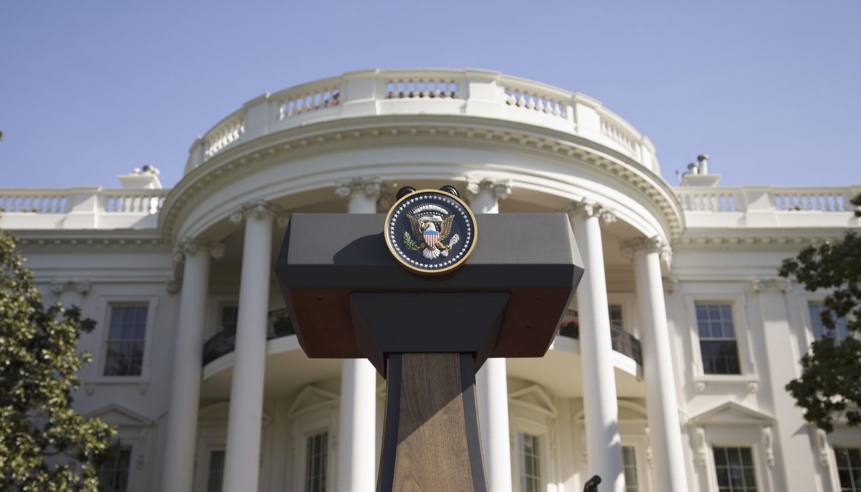 USA, Washington DC, Presidential Seal on podium in front of The White House, low angle view