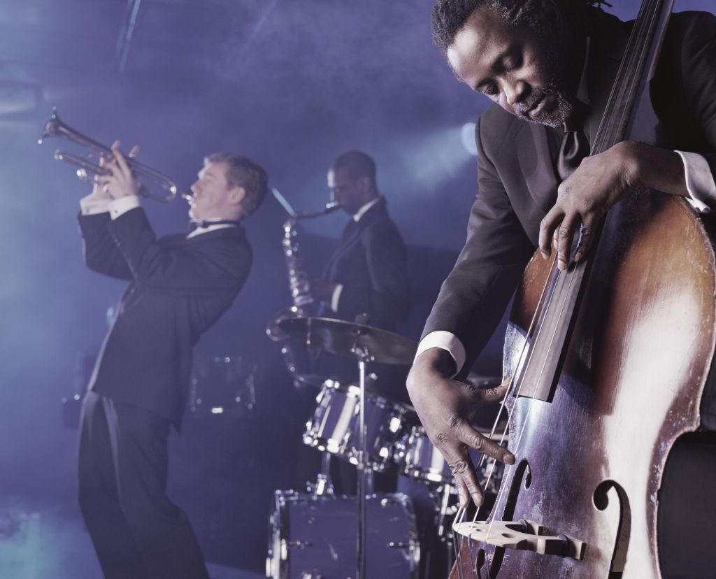 Jazz Band Playing on Stage in a Nightclub, Musician Plucking a Double Bass