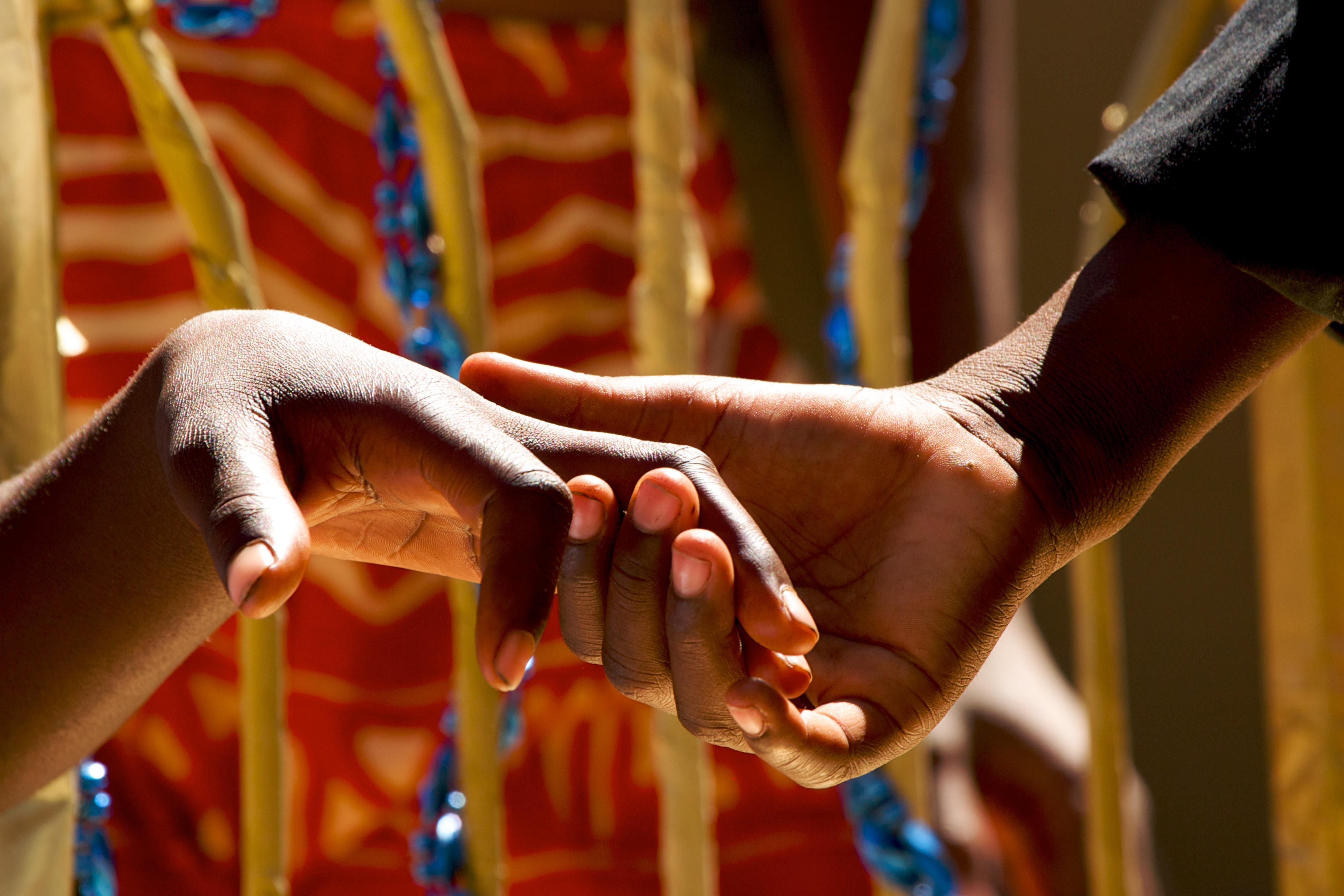Close up of couple holding hands