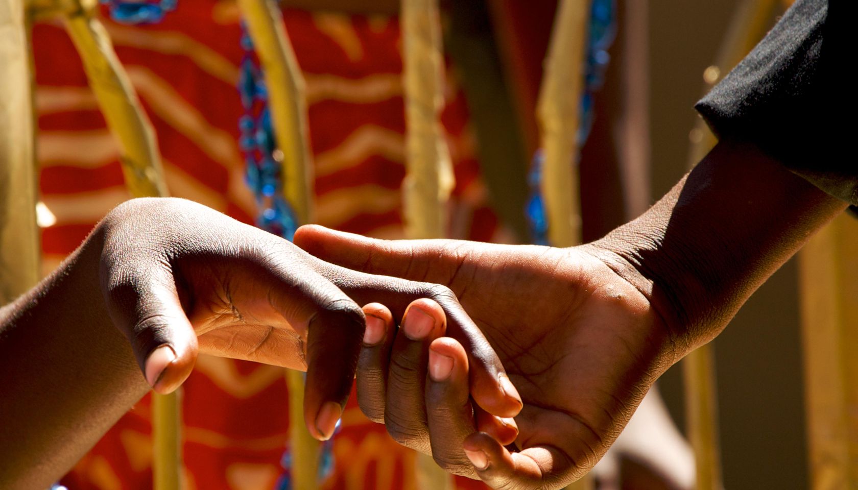 Close up of couple holding hands