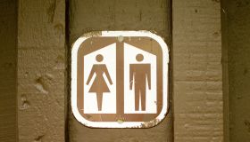 Women/Man sign on out house