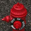 Red fire hydrant, out of service after water main break