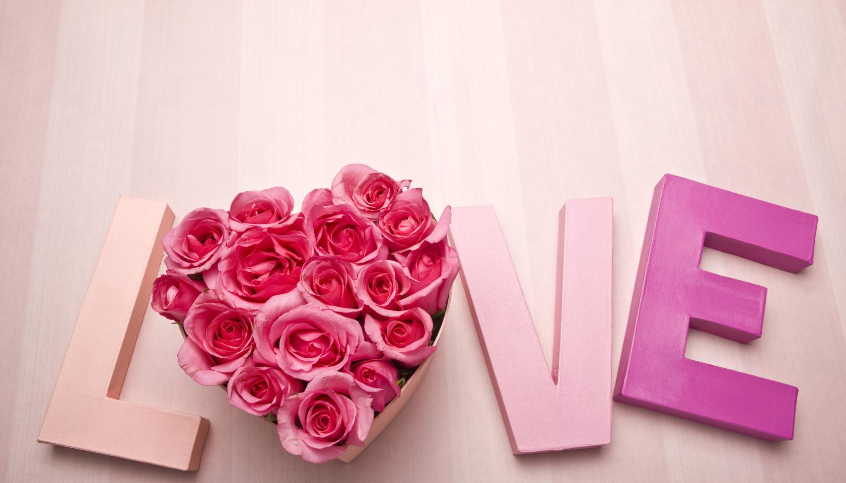 Letters spelling love with roses
