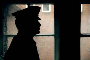 Silhouette of a prison/police warden