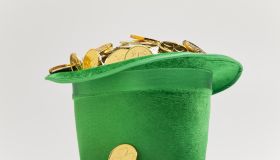 Green hat filled with golden coins