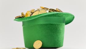Green hat filled with golden coins