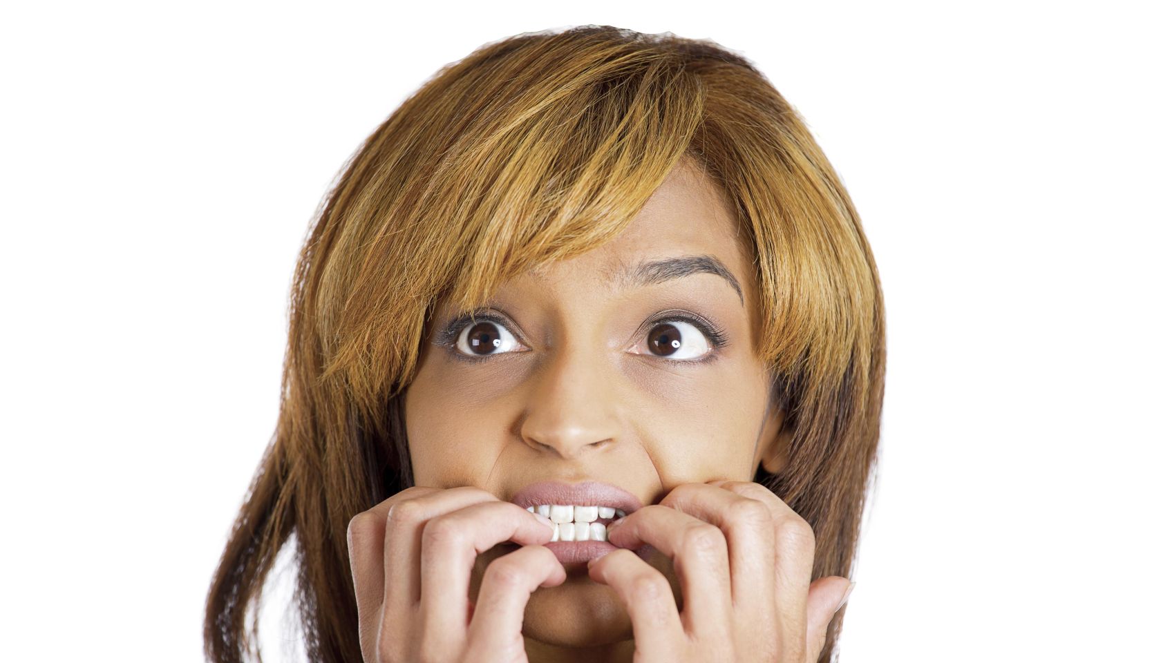 Closeup portrait of young unhappy woman biting her nails and looking to side with a craving for something or anxious worried isolated on white background. Negative emotion facial expression feelings