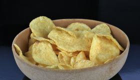 Kettle type potato chips in a wooden bowl
