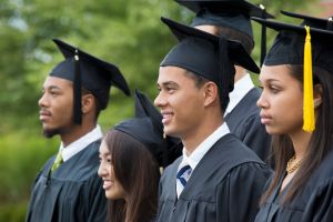 Graduates posing together outdoors