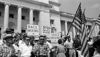 White segregationist demonstrators protesting at the admission of the Little Rock Nine, to Central High School, 1959. The Little Rock Nine were a group of nine African American students enrolled in Little Rock Central High School in 1957. Their enrol