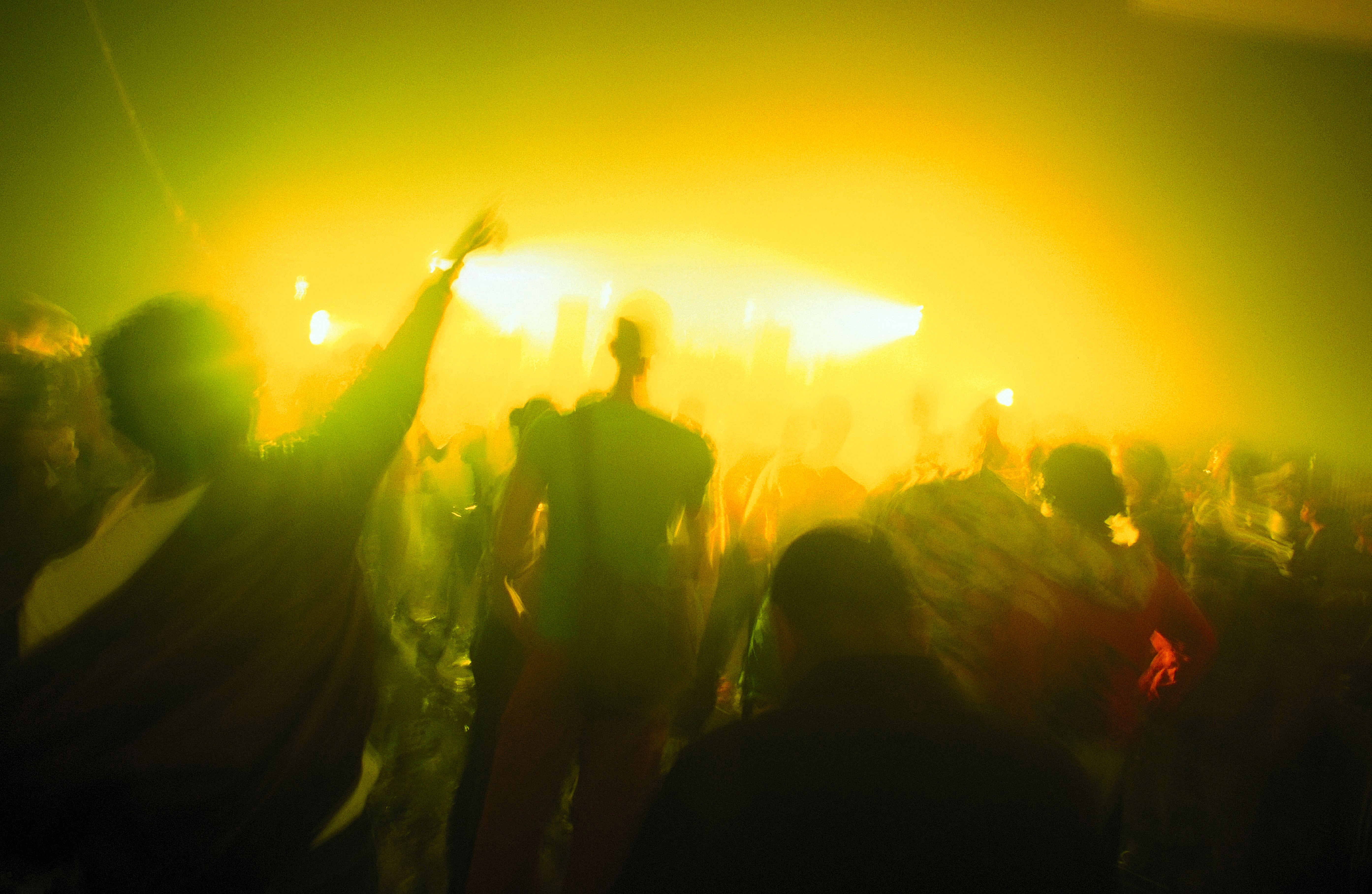 Crowd and yellow lights Dance Valley Holland August 2002