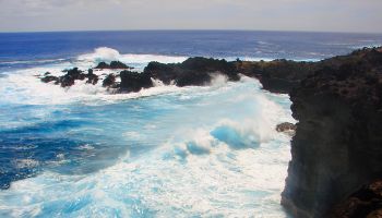 Impressive Easter Island and dramatic coastline shore: blue waves splashing on the rocks formation cliffs - Rapa Nui ancient civilization - Idyllic pacific ocean at dramatic sunset, dramatic landscape panorama – Chile