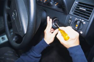 Photography of hands breaking into a car, High Angle View