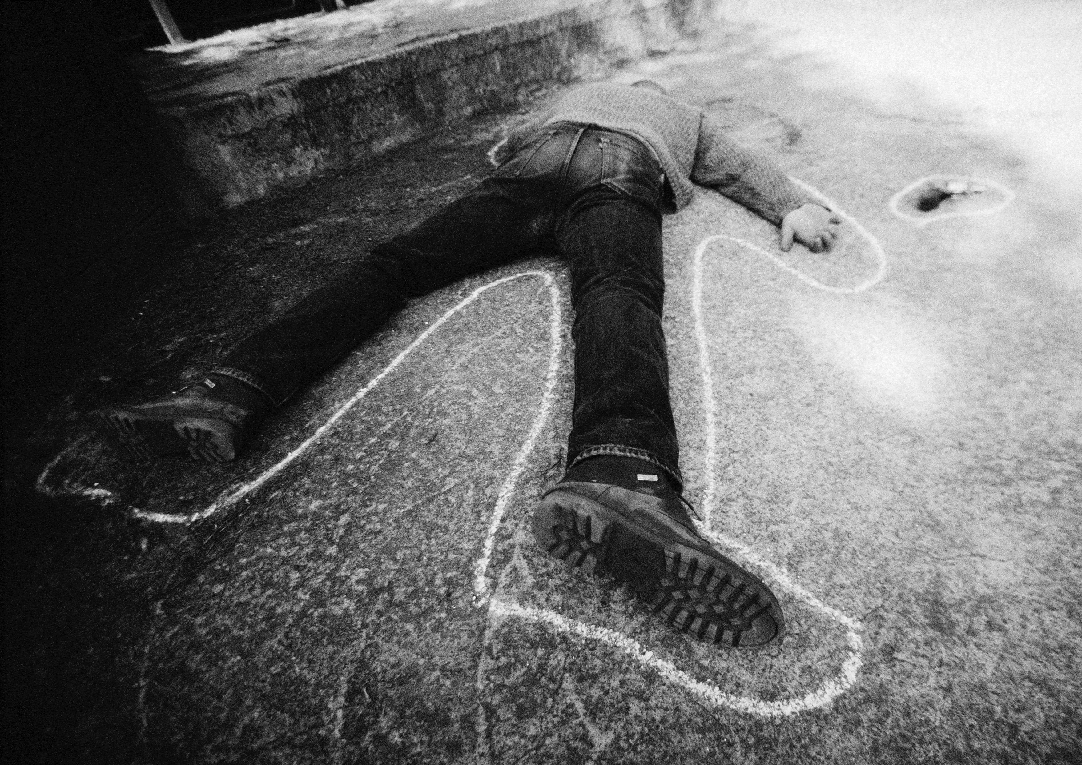 Dead man on ground, b&w