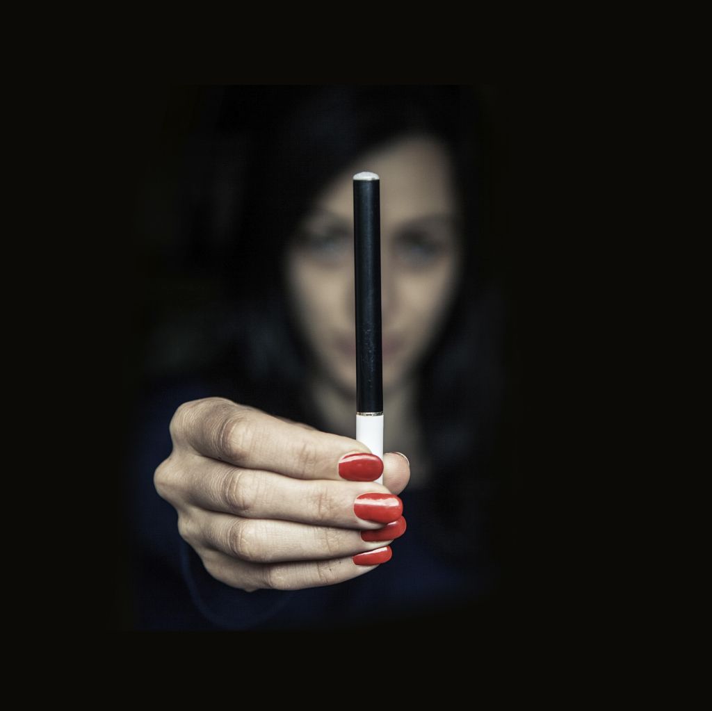 Woman holding an electronic cigarette