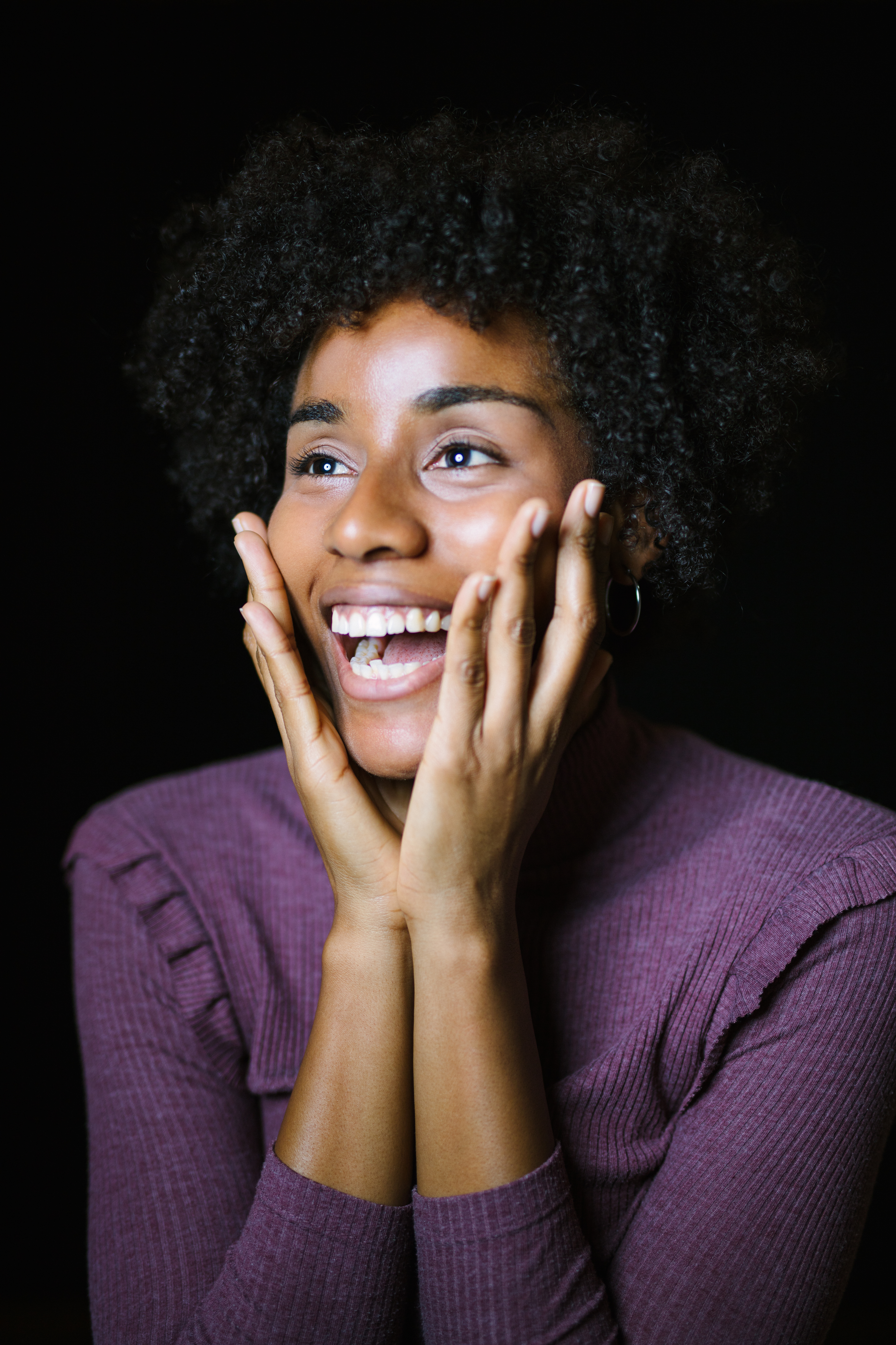 Surprised Woman Looking Away On Black Background