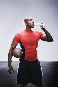 Football player drinking bottled water