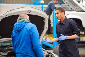 Mechanic explains problem to customer