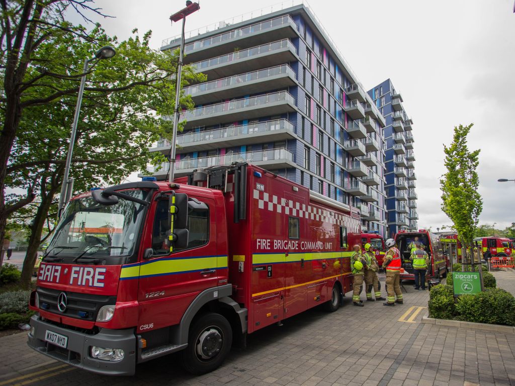 Eight fire engines and around 60 firefighters attend to a fire in a block of flats on Hatton Road, Alperton.
