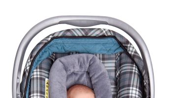 Isolated Newborn Baby In Car Seat
