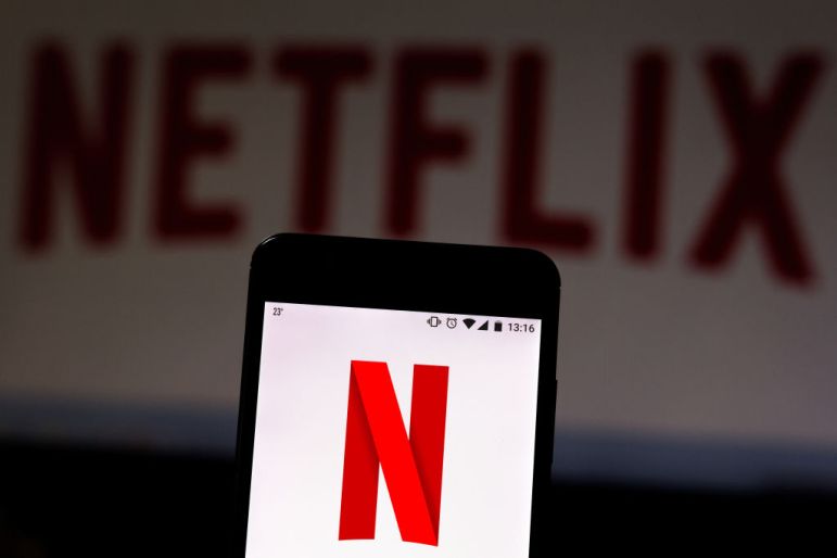 In this photo illustration the Netflix logo is seen...