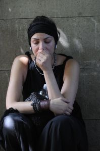 A woman mourns on July 24, 2011, as they