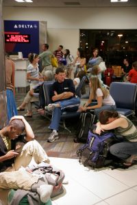 Passengers waiting for a delayed Delta Airlines flight at Hartsfield-Jackson Atlanta International Airport.