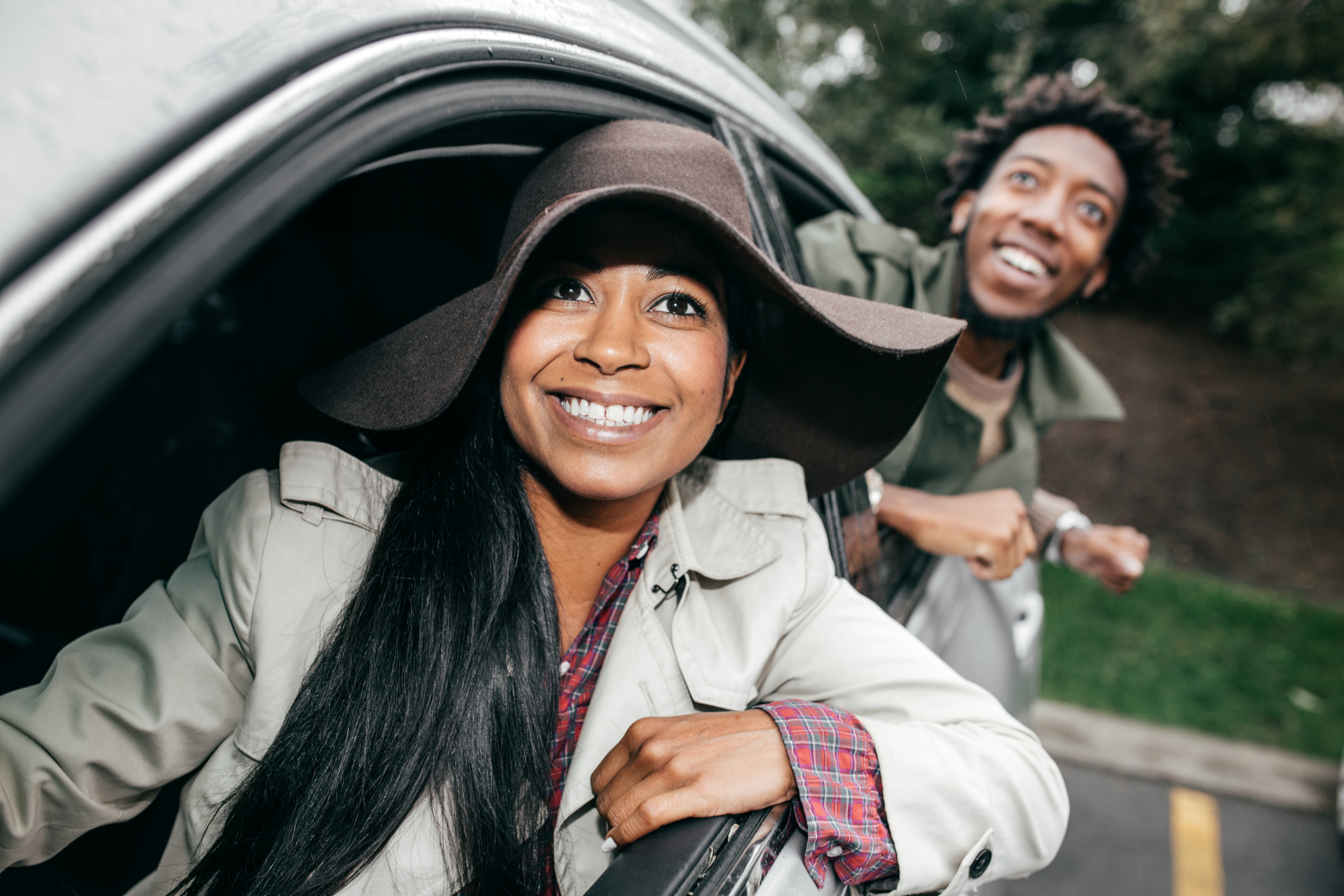 Happy couple with good car insurance
