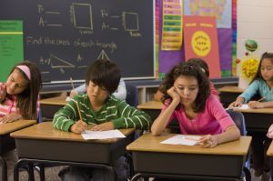 Students taking test in classroom