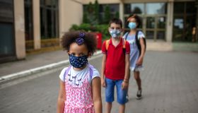Young Students on School Campus Wearing Medical Face Masks