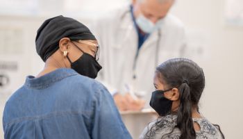 Wearing A Mask at the Paediatrician Office Stock Photo