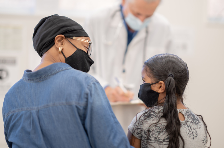 Wearing A Mask at the Paediatrician Office Stock Photo