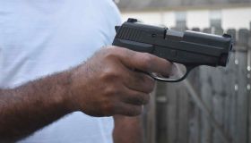 Man holding handgun pistol