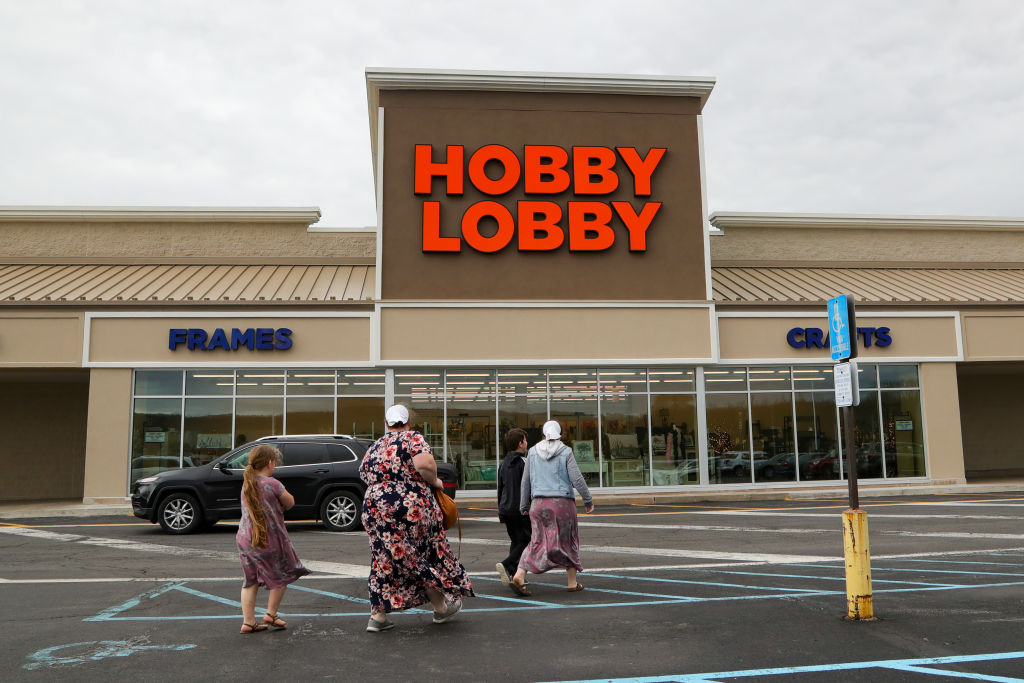 Shoppers are seen in front of a Hobby Lobby arts and crafts...