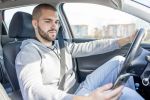 Man using a phone while driving